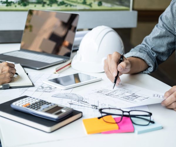 Architecture Engineer Teamwork Meeting, Drawing and working for architectural project and engineering tools on workplace, concept of worksite on technical drawing structure and construction.